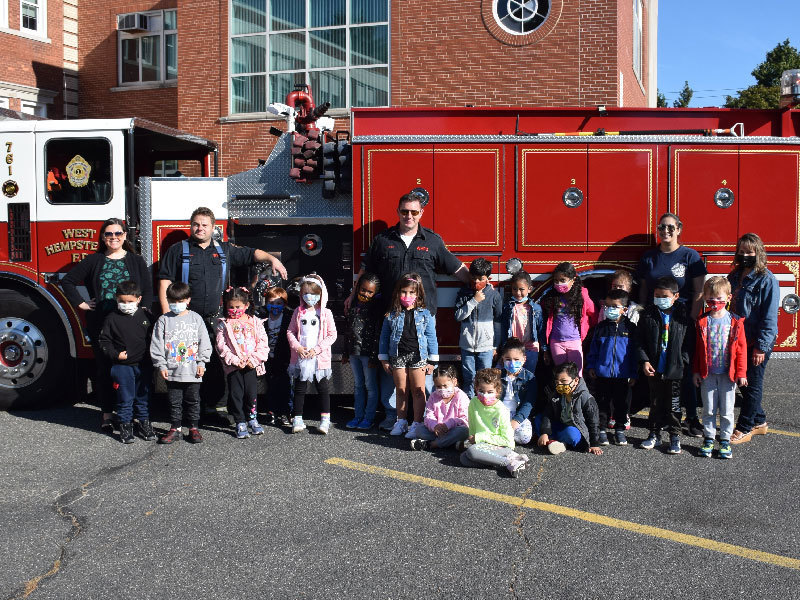 group photo in front of fire truck