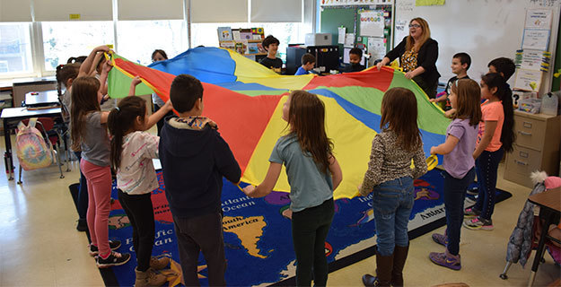 Students With Parachute in Class