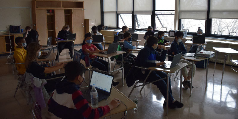 students on computers in classroom