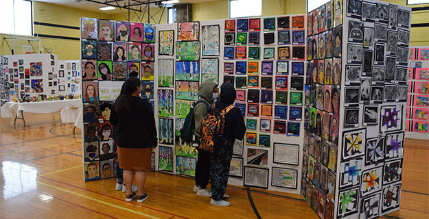 Students Looking at Art at Art Show
