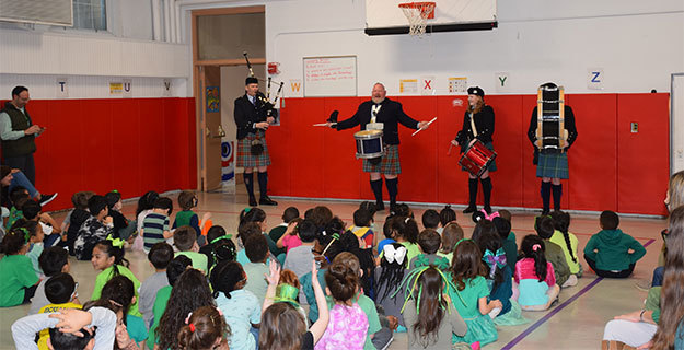 Chestnut Street School Pipe Band Performing to Students