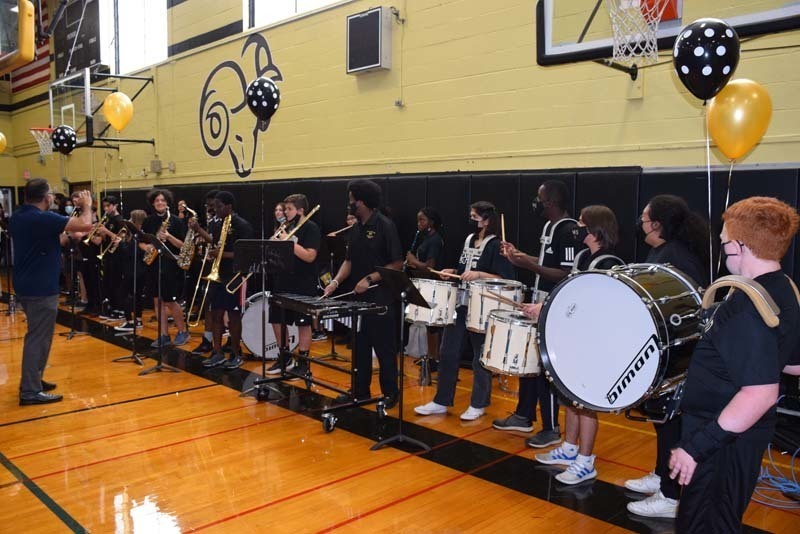 Pep band performing in the gym