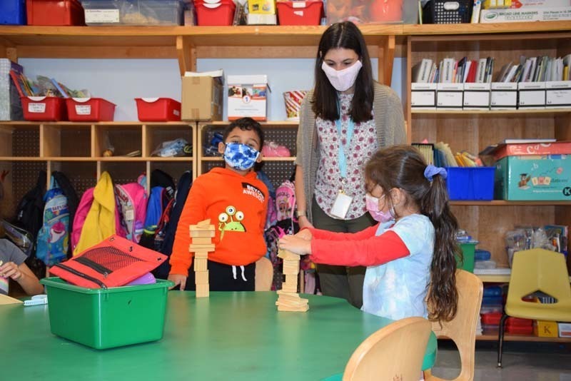 Students Showing The Teacher What They Created