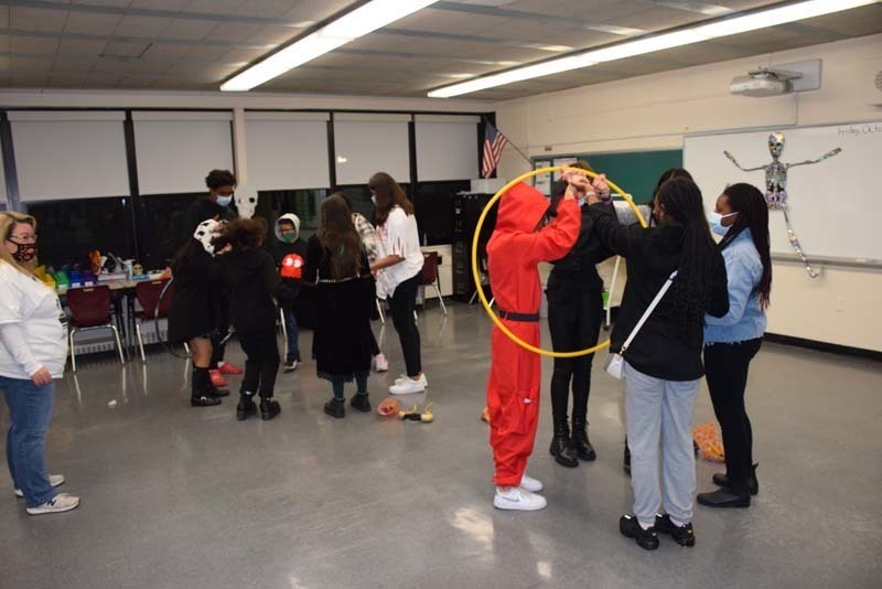 Students also had to get a hula hoop around each other without the breaking the chain.