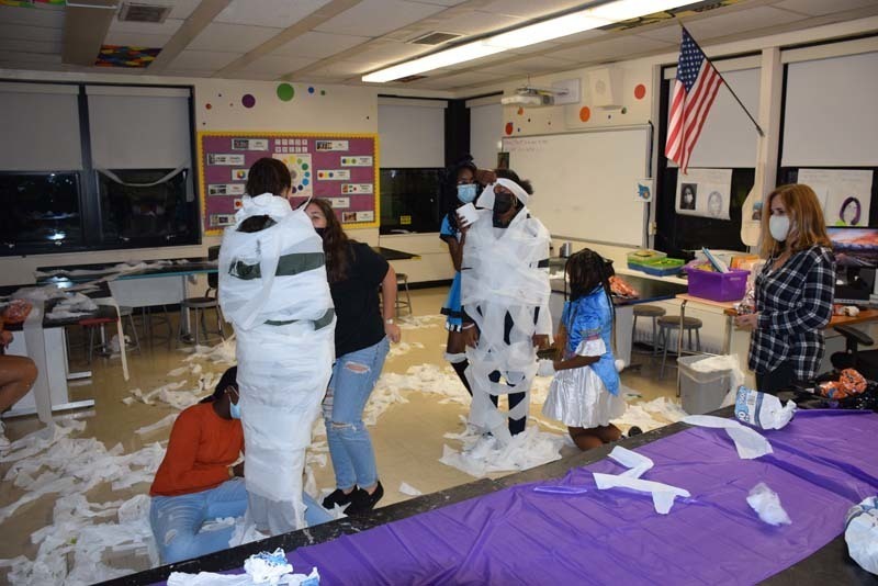 West Hempstead Middle School students were tasked with mummifying each other as part of the school’s inaugural Haunted Halloween Whodunit on Oct. 28