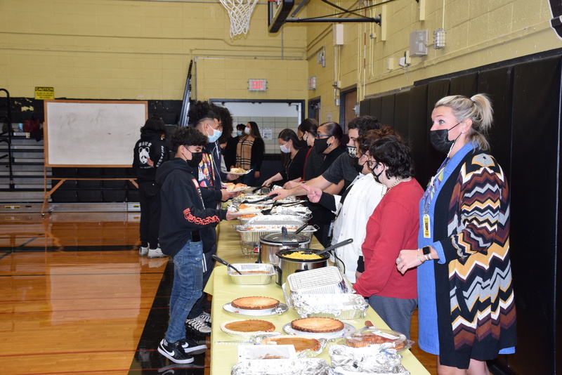 Students and Staff At Thanksgiving Feast