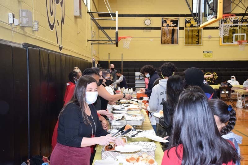 Students and Staff At Thanksgiving Feast