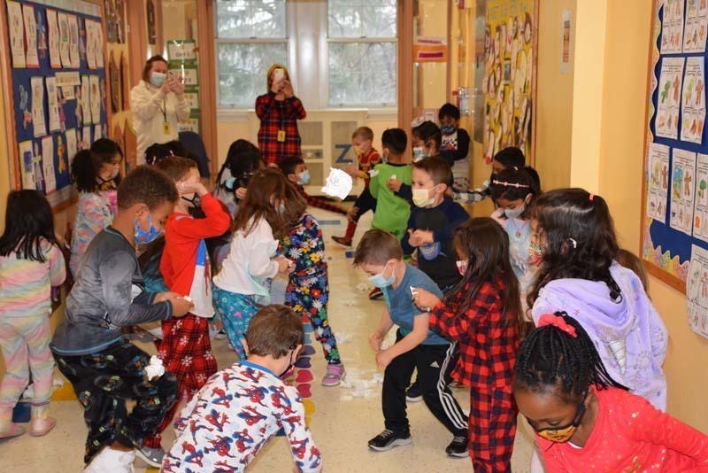 Students Having a Snow Ball Fight With Paper