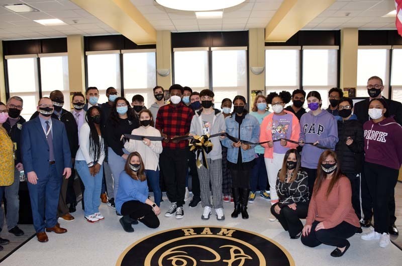 Students, district leaders and staff members gathered at the library for a ribbon-cutting ceremony