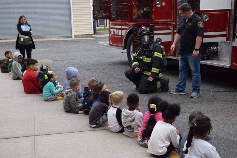 Students Outside With Firefighter and Truck