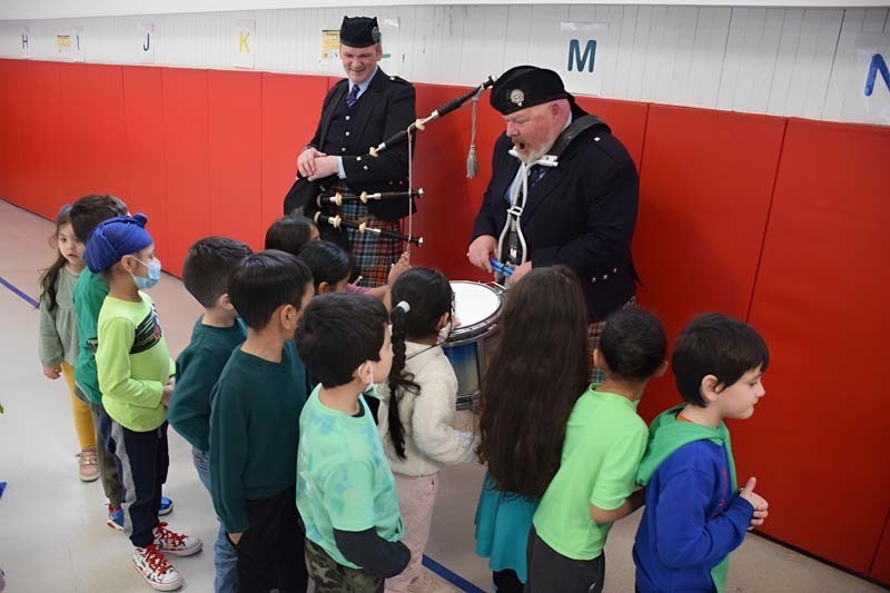 Chestnut Street School Pipe Band performing for students